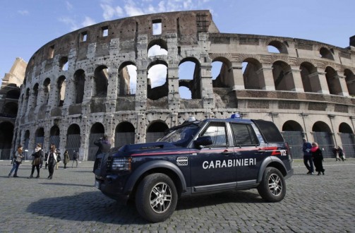Carabinieri paramilitary car patrols in front of the Colosseum in Rome on Feb. 17.  (Max Rossi/Reuters)